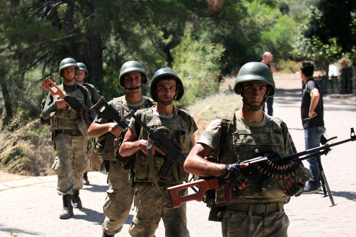 Turkish soldiers search for missing military personnel suspected of being involved in the coup attempt in Marmaris, Turkey, J