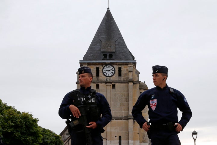 A Syrian refugee is in custody following the murder of an elderly priest at a church in Normandy.