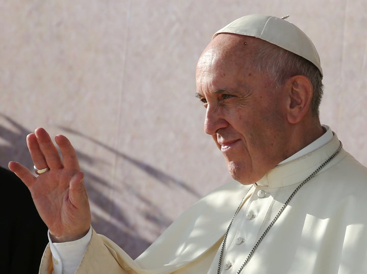 Pope Francis waves as he arrives for the Way of the Cross with the young people gathered at Blonia Park in Krakow, Poland July 29, 2016.