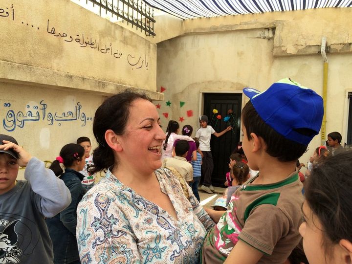 Ola Al-Junde, 43, is a Syrian math teacher who juggles her day job managing one school for Syrian refugee kids with volunteering at others.