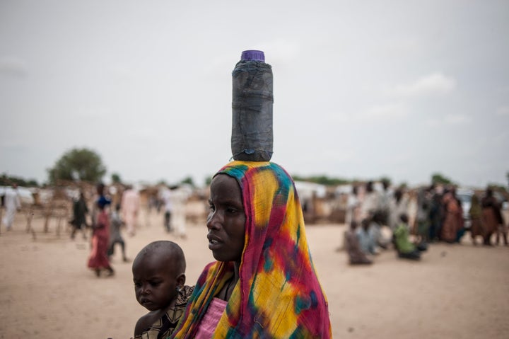 A woman carried her daughter to the nutrition clinic in Muna. Over 2 million people have been displaced by the deadly insurgency by militant group Boko Haram.