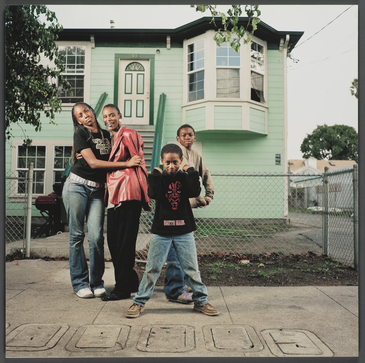 “952 Chester Street,” a 16x16 giclee print from 2003 by Julie Placensia, is included in the exhibition “Oakland, I want you to know...” at the Oakland Museum of California. Zolika Boissiere, an Oakland native, lived in the front unit from 1997 to 2007. Her son Marquees (not pictured) was shot and killed three blocks from the house shortly after the family moved out.