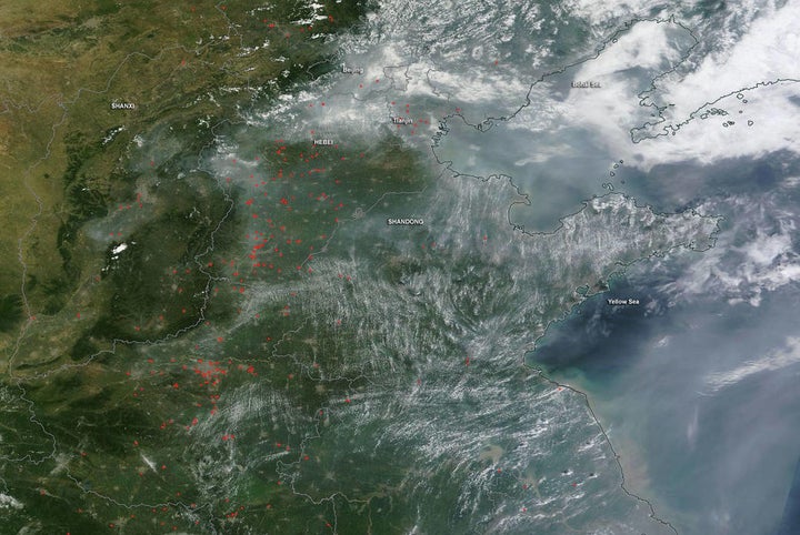 "On July 29, 2016, fires peppered the ground while smoke spread across the skies over eastern China. The Moderate Resolution Imaging Spectroradiometer (MODIS) on NASA’s Terra satellite captured this natural-color image. Dozens of fires, marked by red outlines, appear south and southwest of Beijing. Smoke appears most thick over the Shandong Bandao peninsula. Many, if not most, of the fires in this image are agricultural fires." -- NASA