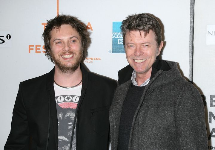 Director Duncan Jones attends the premiere of his film "Moon" with his father, David Bowie, in 2009.