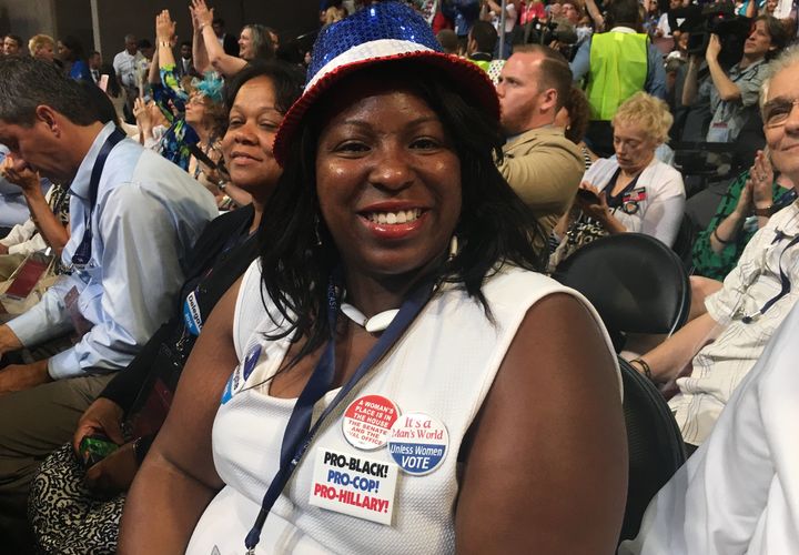 Rogette N. Harris, a Hillary Clinton delegate from Pennsylvania, wears a pin that reads, "Pro-Black, Pro-Cop, Pro-Hillary" while sitting on the floor of the Democratic National Convention in Philadelphia. Criminal justice reform is one of her top issues as a voter.