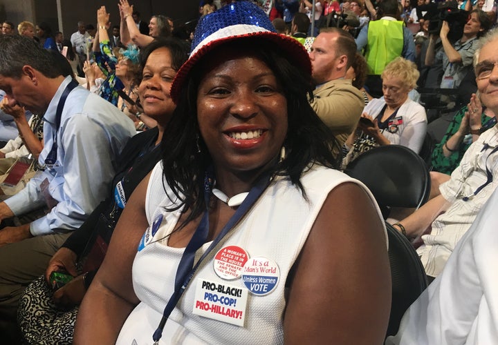 Rogette N. Harris, a Hillary Clinton delegate from Pennsylvania, wears a pin that reads, "Pro-Black, Pro-Cop, Pro-Hillary" while sitting on the floor of the Democratic National Convention in Philadelphia. Criminal justice reform is one of her top issues as a voter.