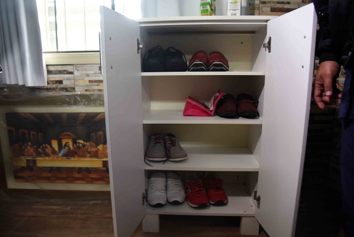 This photograph shows how he liked to store his footwear.