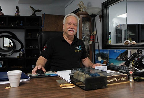 <em>Photo by Nancy A. Ruhling</em><br><strong>Antonio collects eagle statues and graffiti art.</strong>