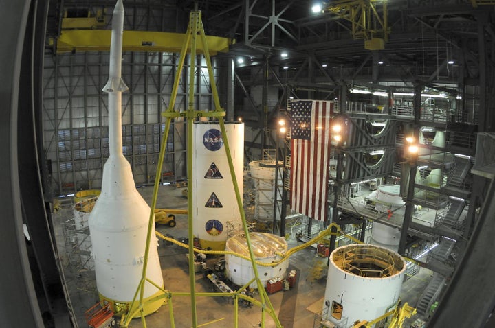 Pieces of an Ares rocket come together inside NASA’s Vehicle Assembly Building at Kennedy Space Center, Florida, prior to an October 2009 test flight.