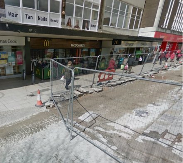 The victim was found injured outside McDonald's in Tameside