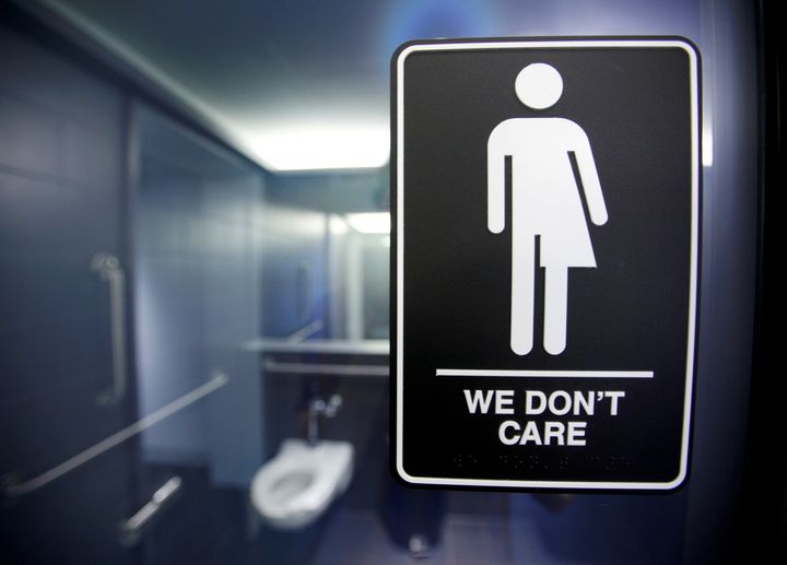 A sign protesting a recent North Carolina law restricting transgender bathroom access is seen in the bathroom stalls at the 21C Museum Hotel in Durham, North Carolina May 3, 2016. (REUTERS/Jonathan Drake/File Photo)