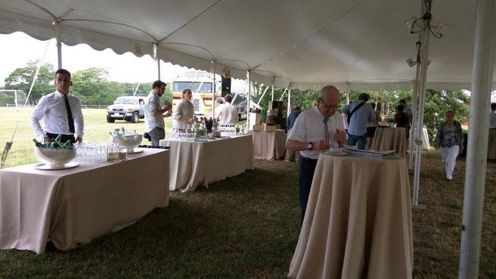 Pre-dinner cocktails are served in a tent on the school's 13-acre rural grounds.
