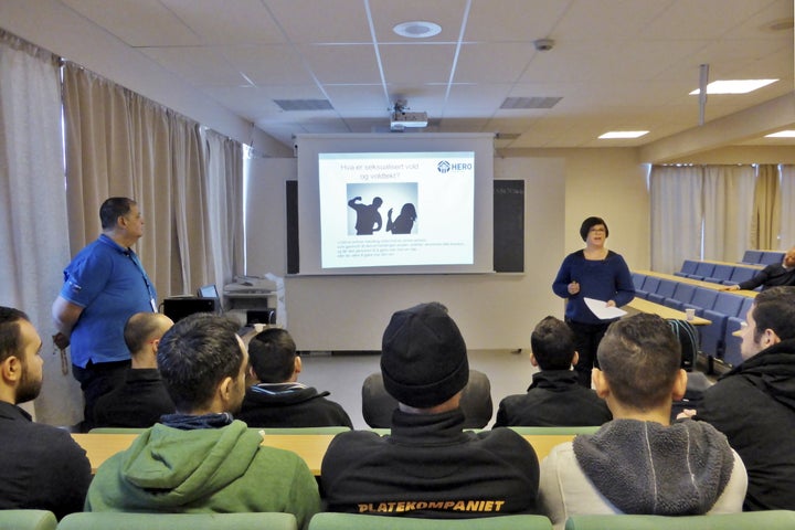 Translator Callas Moustapha (L) looks on as teacher Linda Hagen delivers a lecture to Syrian asylum seekers at a one-day course to prevent sexual violence at a reception centre for asylum seekers in Naerboe, Norway, January 19, 2016.