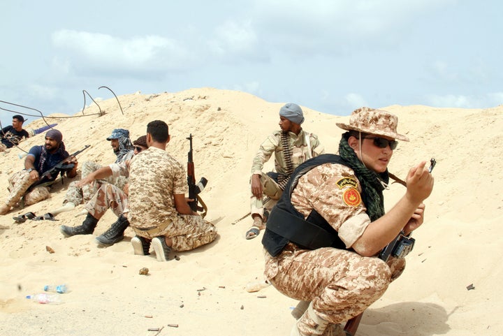 Fighters from pro-government forces loyal to Libya's Government of National Unity (GNA) target the Islamic State in Sirte in