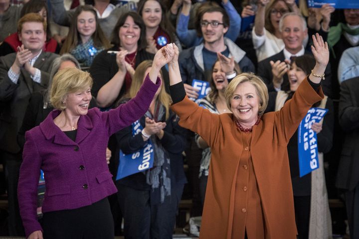Hillary Clinton, right, is joined on stage by Sen. Tammy Baldwin during a campaign event in Eau Claire, Wisconsin, on Saturday, April 2, 2016.