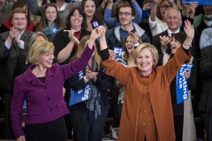 Hillary Clinton, right, is joined on stage by Sen. Tammy Baldwin during a campaign event in Eau Claire, Wisconsin, on Saturday, April 2, 2016.