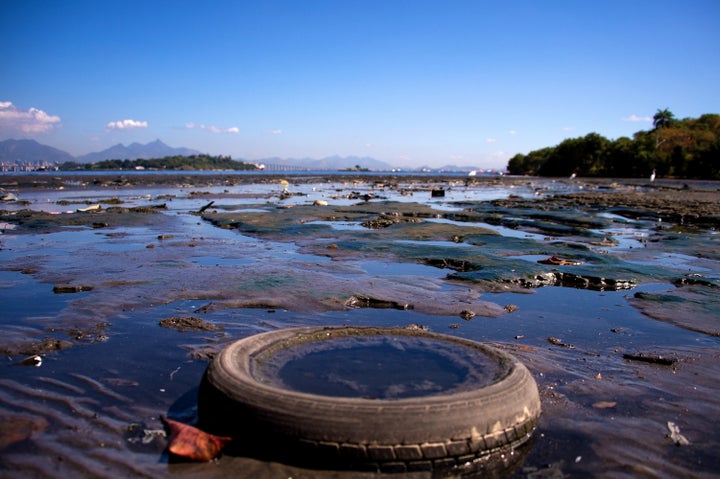 Debris sits near the shoreline of the polluted waters of Guanabara Bay between the cities of Rio de Janeiro and Niteroi on July 30, 2014, in Rio de Janeiro, Brazil. The iconic bay will be the site of sailing events during the Rio 2016 Olympic Games.