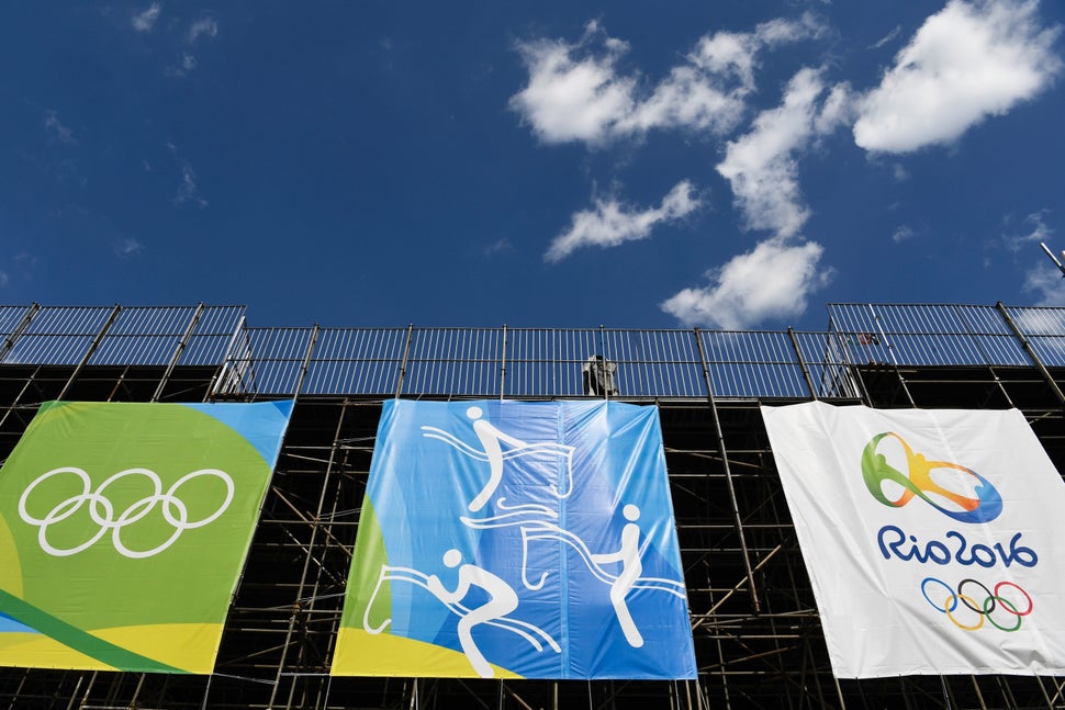 Banners hang on a structure at the Olympic Equestrian Centre in Rio de Janeiro. Brazilians are conflicted about their country