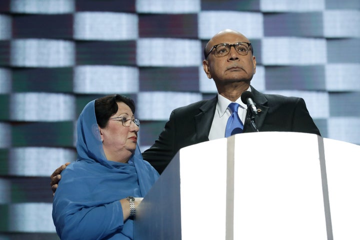 Khizr Khan, father of deceased U.S. Army Capt. Humayun S. M. Khan, delivers remarks as he is joined by his wife Ghazala Khan on the fourth day of the Democratic National Convention at the Wells Fargo Center, July 28, 2016.