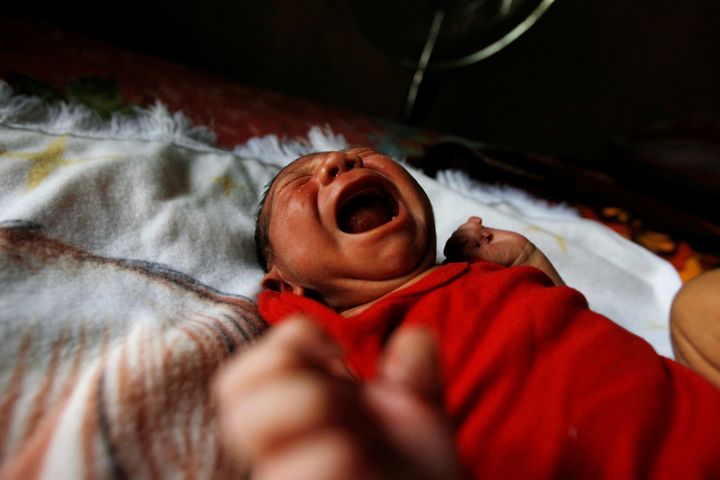 Eight-day old baby Allan, who was born with microcephaly, cries at home in Choluteca, Honduras, July 29, 2016.