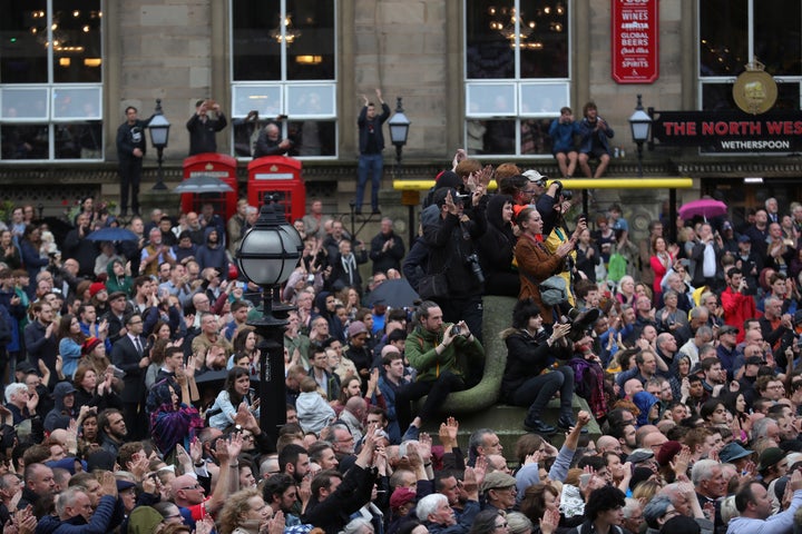 People cheer and wave placards as Labour Leader Jeremy Corbyn addresses thousands of supporters in St George's Square.