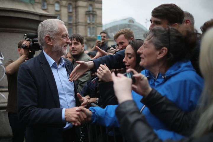 Corbyn shakes hands with supporters after addressing thousands of people in St George's Square.