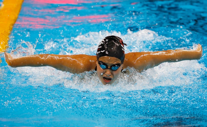 Yusra Mardini, pictured practicing at the Olympic swimming venue, had to swim for her life when the boat she was riding on to