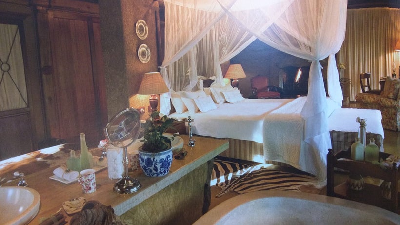 Curtained bed in a suite bedroom
