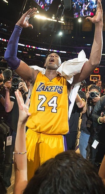 A photo from Bryant's last game, notice the lack of animosity towards this criminal. 