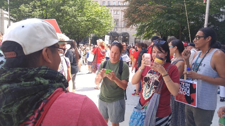 <em>Julie Maldonado, center in green shirt, with other members of the caravan</em>