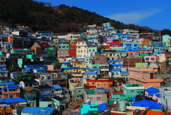 Gamcheon Culture Village | This colorful village is located along a coastal hillside in Busan on the East Sea. Born out of the Taegeukdo religion after the Korean War, the tiered village was set up so that no house blocks another. The houses are all bright, pastel colors, making the village reminiscent of Greece’s Santorini or Rio’s favelas, and many abandoned houses have been transformed into art exhibition pieces...Read More