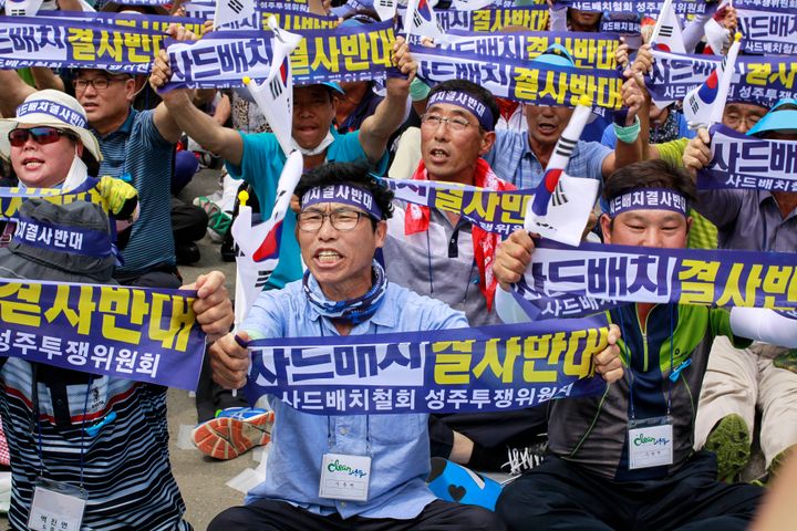 South Koreans protest a plan to deploy an advanced U.S. missile defense system called Terminal High-Altitude Area Defense, or THAAD, in their neighborhood, in Seoul, South Korea, on July 21.