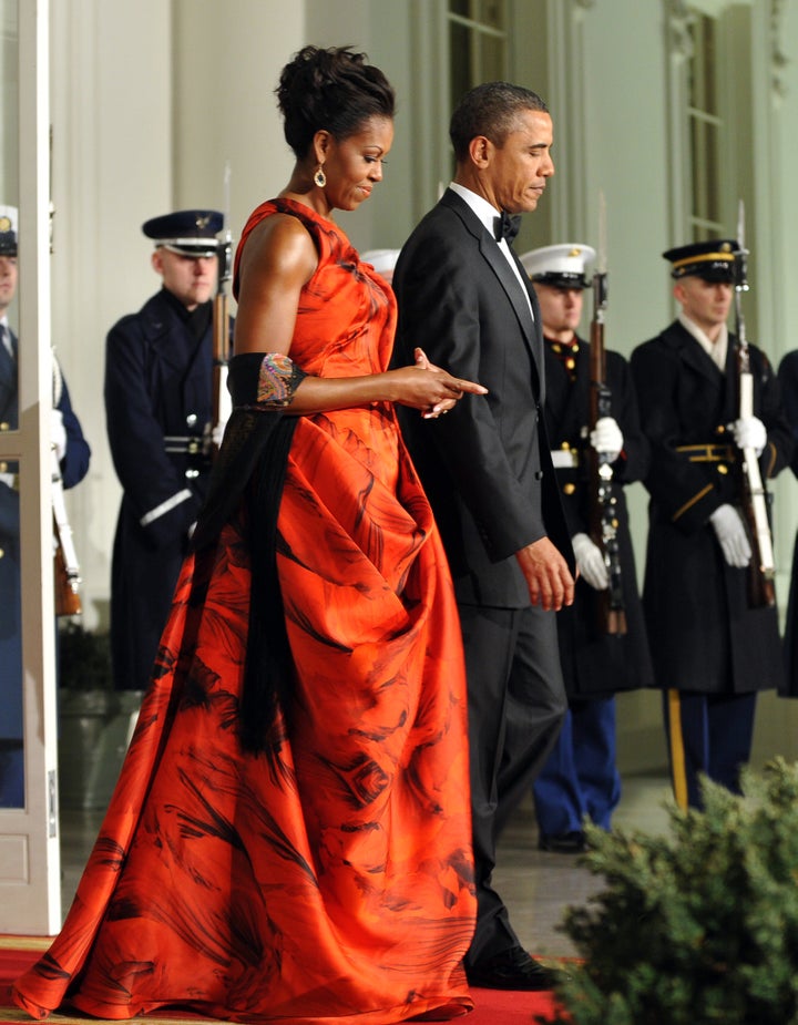 Wearing a red gown by Sarah Burton for Alexander McQueen at a 2011 state dinner for Chinese President Hu Jintao. 