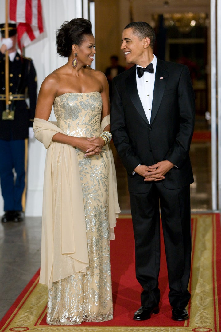 Dazzling in Naeem Khan at the Obamas' first state dinner in 2009. The dinner honored India's Prime Minister Manmohan Singh and his wife, Gursharan Kaur.