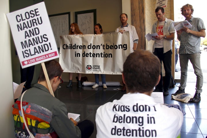 Australia is allegedly ignoring the abuse of refugees to deter others from arriving on its shores. Pictured here, protestors decry the alleged mistreatment of asylum seekers being held in offshore detention centers.