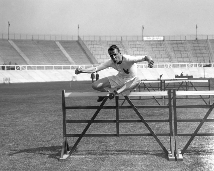 Hurdles or fencing? Canada's Frank Savage during the heats of the 110 metre hurdles during the 1908 London games