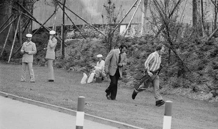 Black September kidnapped 11 members of the Israeli Olympic team in Munich in 1972. This image shows a sharpshooter rushing to the Olympic village where extremists were holding the Israeli atheletes hostage