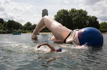Rebecca swims alongside her tribute statue in London's Serpentine