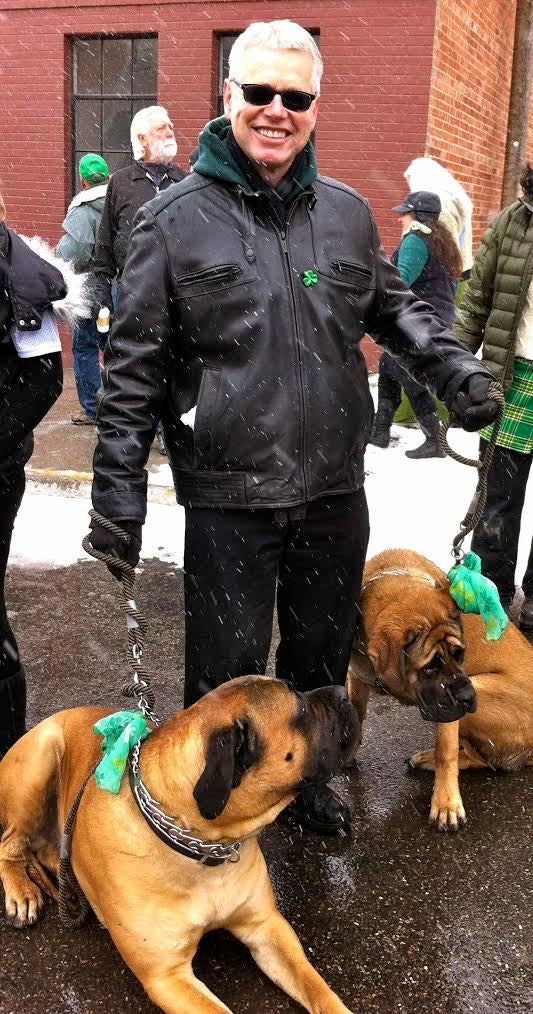 Tristan and Ysolt watching the St Patrick's Day Parade in Butte during a snow fall 