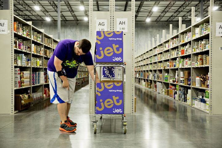 An employee collects items for customer orders at the Jet.com Inc. fulfillment center in Kansas City, Kansas.