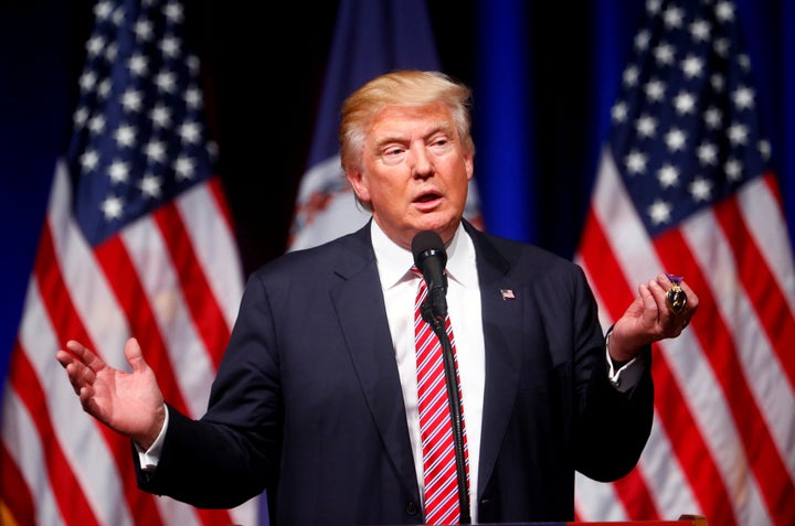 <strong>Donald Trump holds up a Purple Heart during a campaign event at Briar Woods High School in Ashburn, Virginia.</strong>