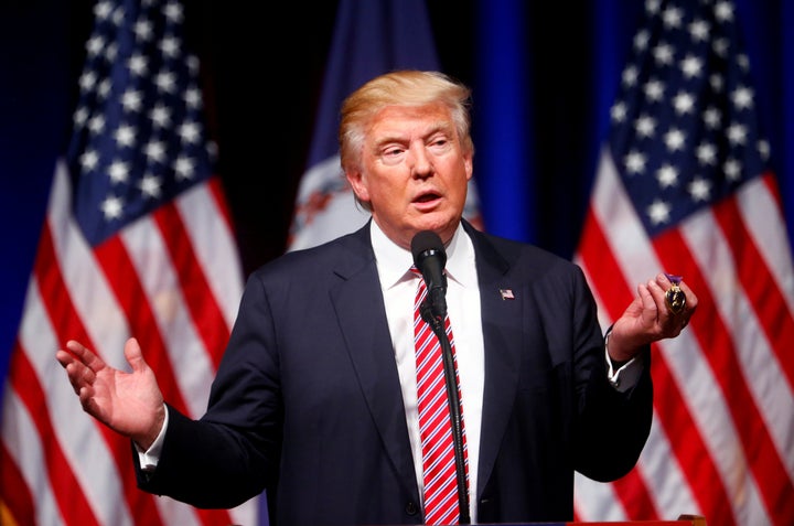 Donald Trump holds up a Purple Heart during a campaign event at Briar Woods High School in Ashburn, Virginia.