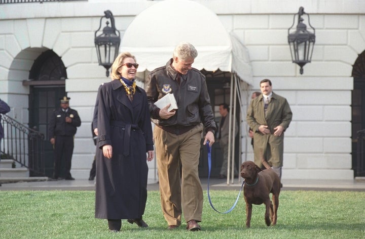 Hillary and Bill Clinton with Buddy the dog at The White House. The Clintons give us hope that partners can not only survive but thrive after overcoming infidelity.