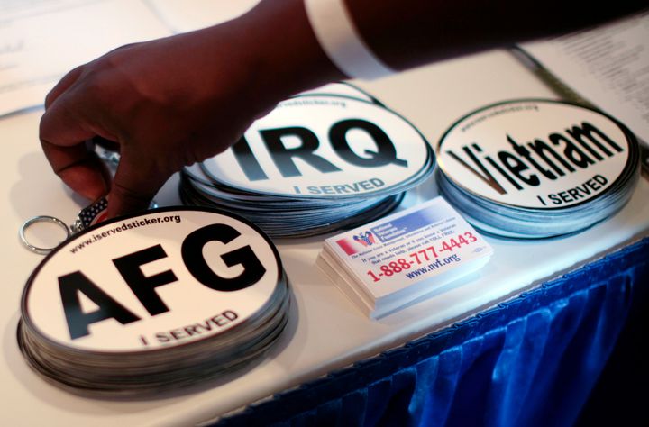 Car stickers commemorating U.S. military service in Vietnam, Afghanistan and Iraq are seen on a recruiter's table at a veterans job fair in Los Angeles, California November 10, 2010. (REUTERS/Lucy Nicholson)
