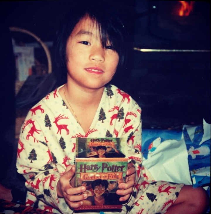Christmas circa age 6, holding the 4th Harry Potter book on cassette tape.