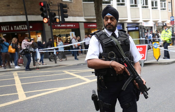 An armed police officer attends the scene of a knife attack in Russell Square in London, England, on Thursday.