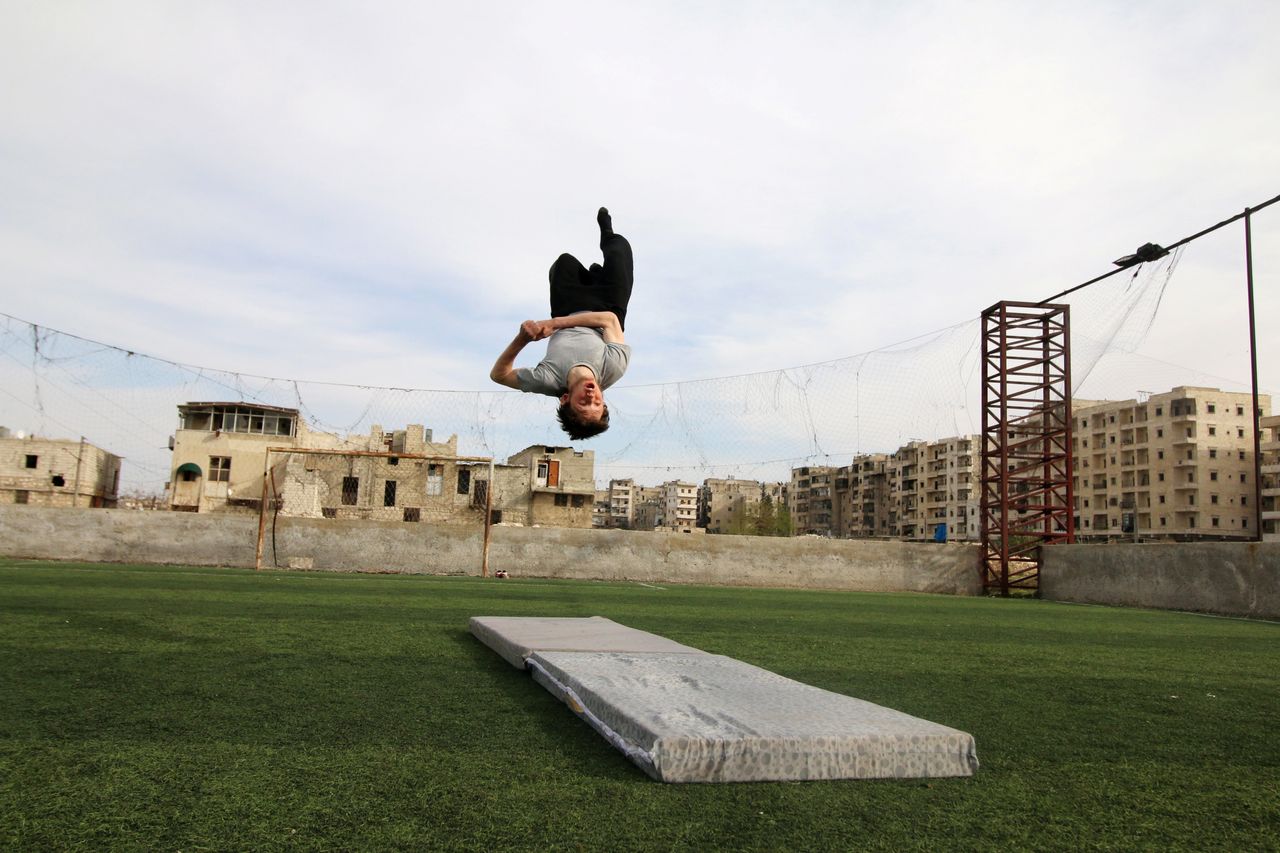 Syrian gymnast Ahmad al-Sawas practises in the rebel-held Bustan al-Qasr neighbourhood of Aleppo, Syria on March 23, 2016.
