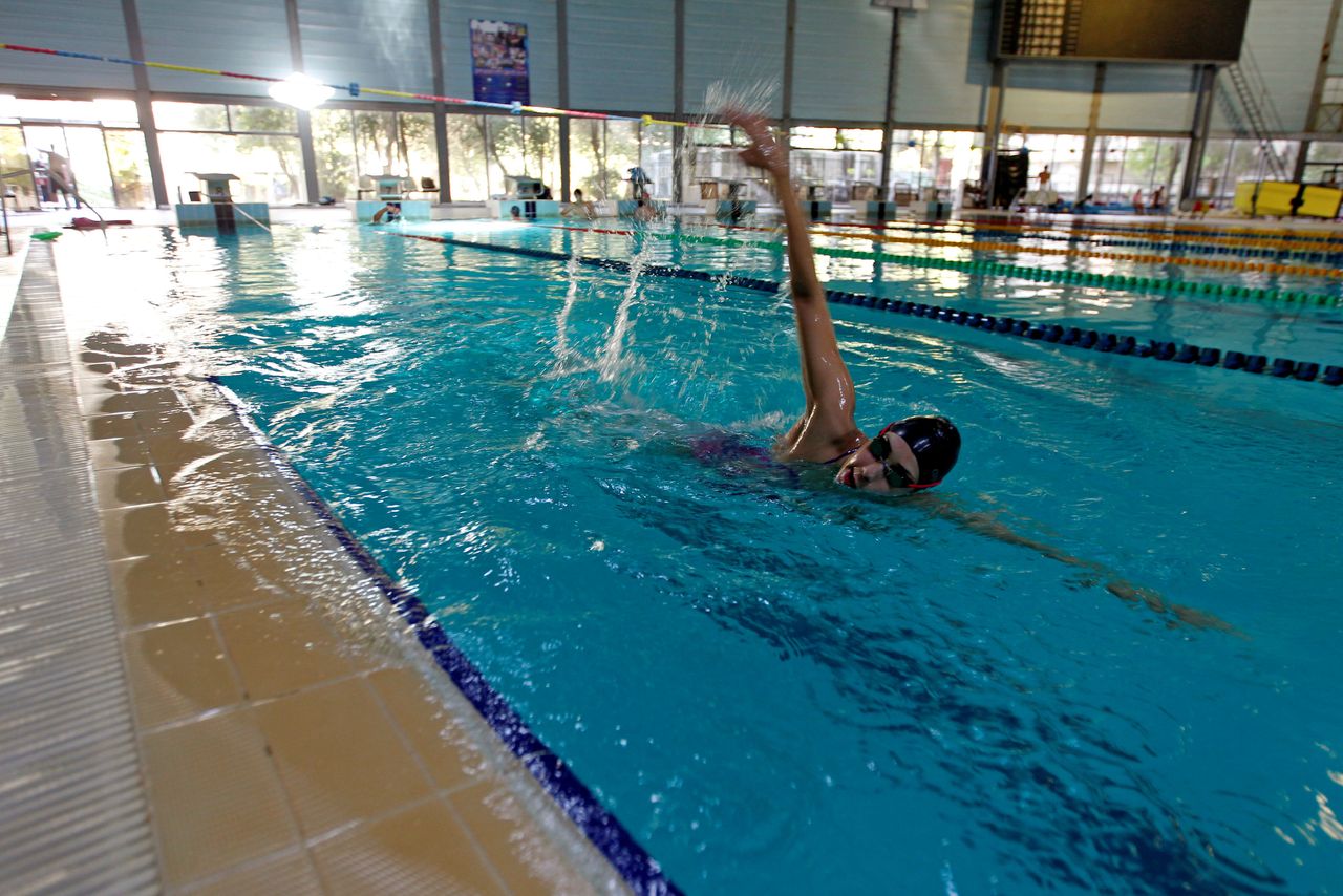 Syrian swimmer Baean Jouma trains in Damascus on July 16. Syria is sending seven athletes to the Rio Olympics, but those who live in rebel-held areas will not be able to compete.