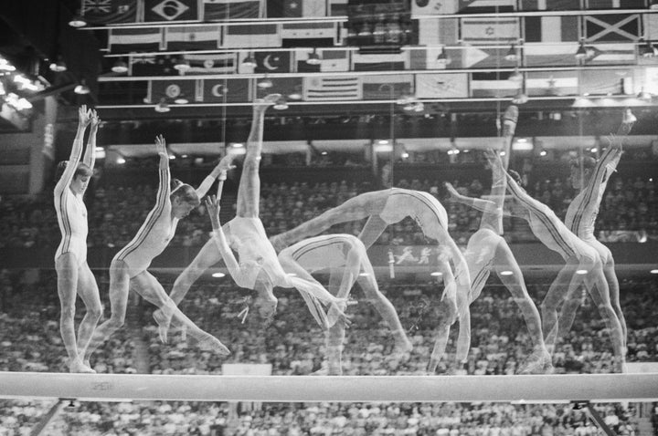 Multiple exposure show's Romania's Nadia Comaneci on the balance beam,