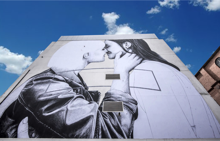 The mural, titled "Love Wins," is located on the side of a five-story building in downtown Belfast. 
